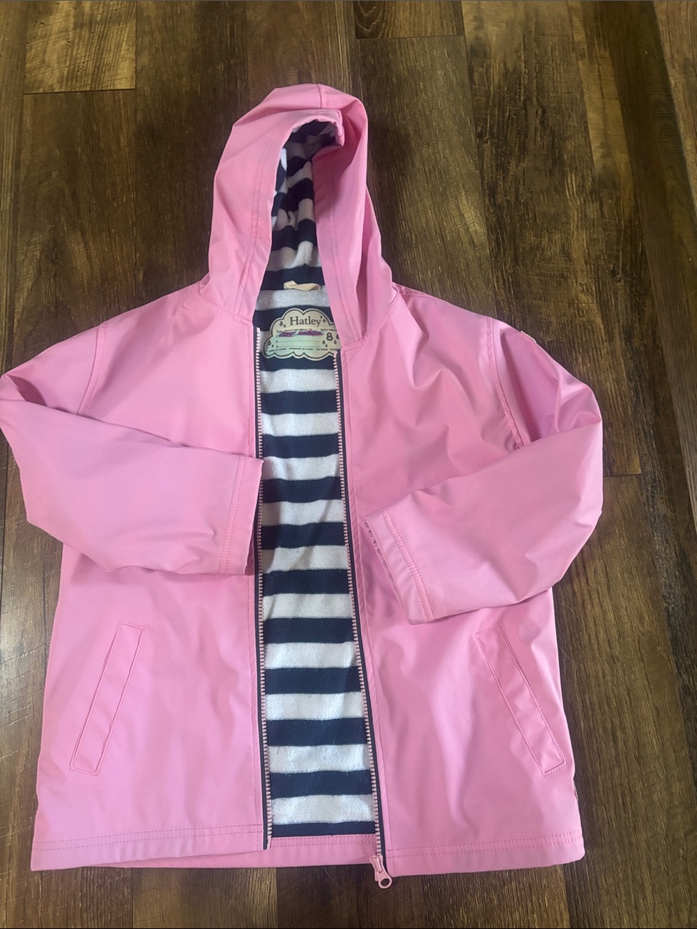 Hatley Pink Hooded Kids Raincoat with Navy Stripe Lining